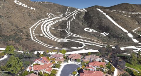 View from Ferncreek Lane of proposed Safari Highlands Ranch Road - note proximity to waterfall